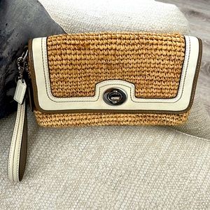 Gorgeous lightly used coach wicker clutch with leather details!